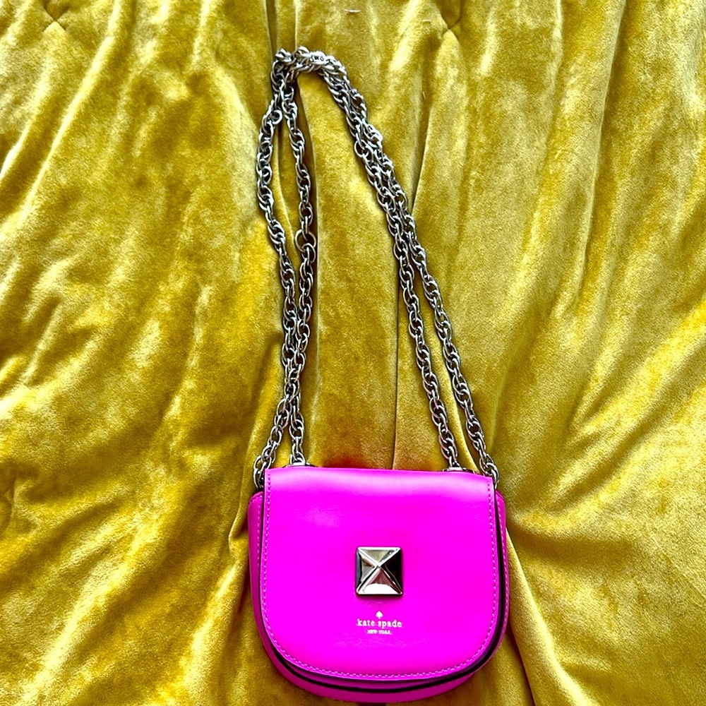 Pink Kate Spade micro purse with convertible chain